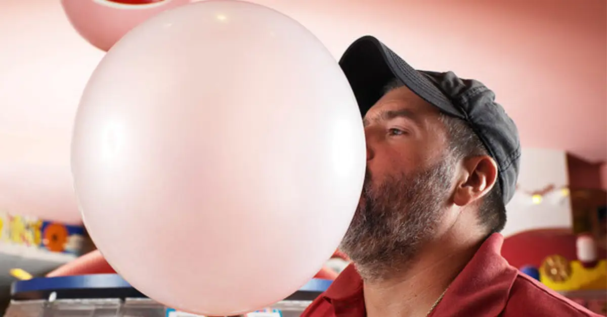 Chad Fell blowing an enormous pink bubble